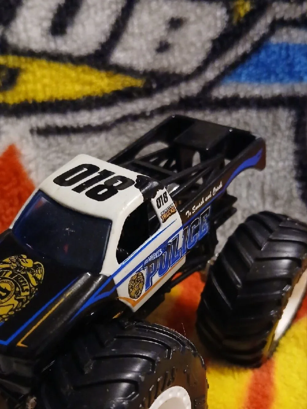 Police Hot Wheels Monster Truck Toy — Black, White & Blue